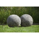 A LARGE PAIR OF LIMESTONE ORNAMENTAL SPHERES, LATE 20TH CENTURY