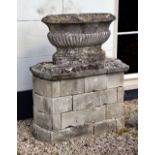 A FRENCH CARVED LIMESTONE OVAL CISTERN, 19TH CENTURY