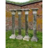 A SET OF FOUR CARVED LIMESTONE COLUMNS, 20TH CENTURY