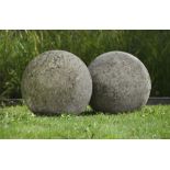 A LARGE PAIR OF LIMESTONE ORNAMENTAL SPHERES, LATE 20TH CENTURY