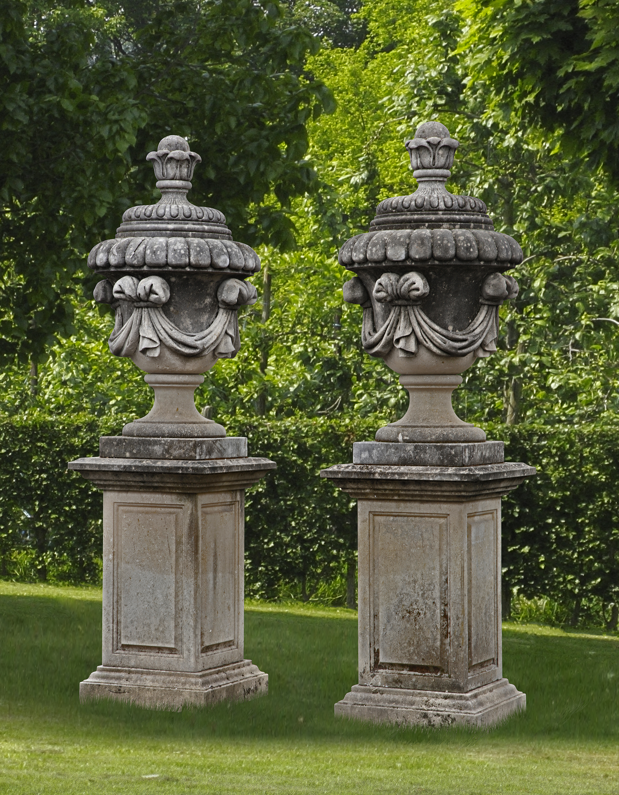 A PAIR OF CARVED LIMESTONE GARDEN URNS SECOND HALF 20TH CENTURY