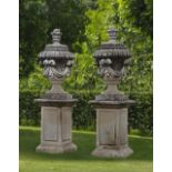 A PAIR OF CARVED LIMESTONE GARDEN URNS SECOND HALF 20TH CENTURY