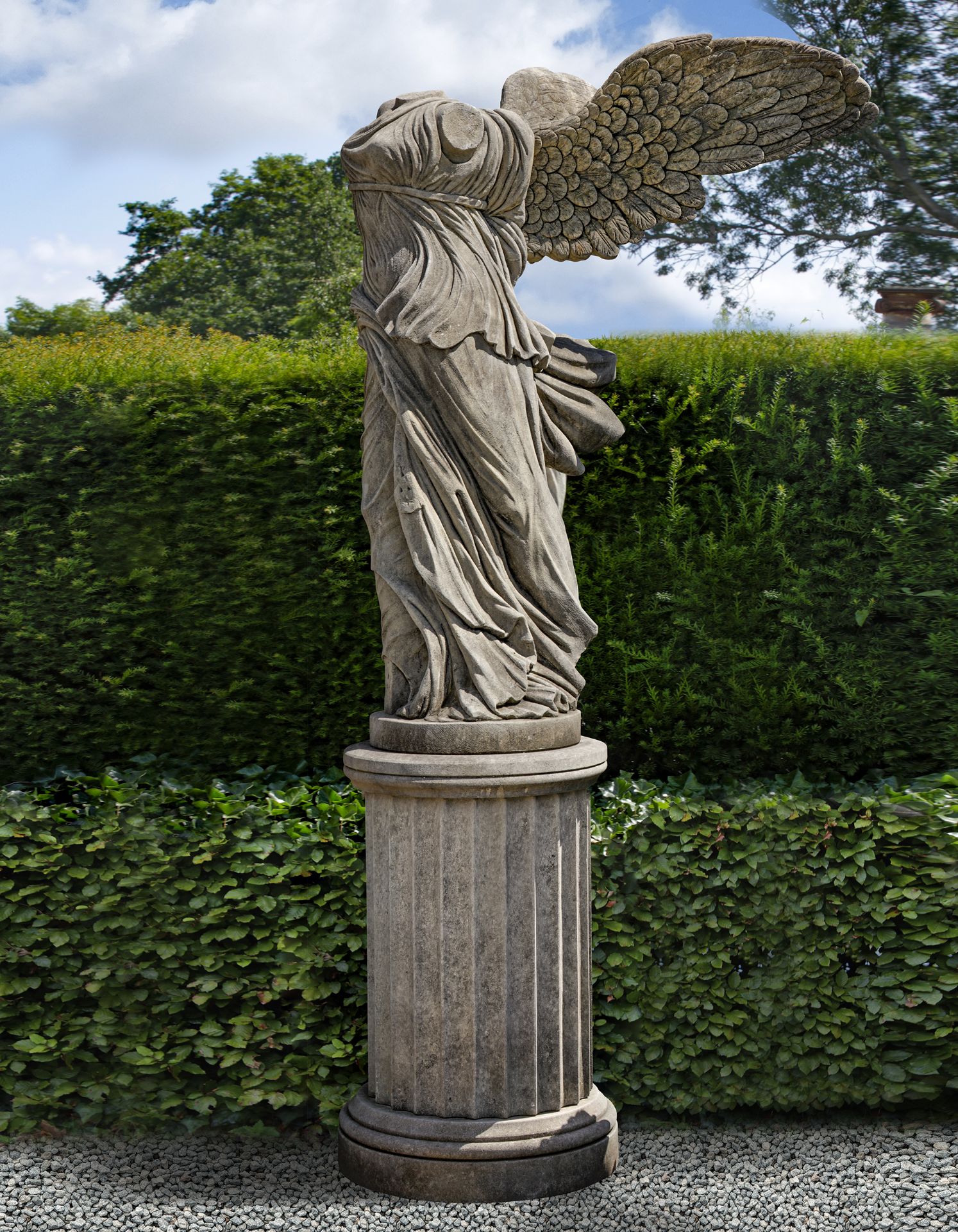 A LARGE AND IMPRESSIVE SCULPTED LIMESTONE MODEL OF THE SAMOTHRACE NIKE, LATE 20TH CENTURY