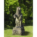 A SCULPTED LIMESTONE MODEL OF A GRIZZLY BEAR OF RECENT MANUFACTURE