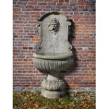 A CONTINENTAL SCULPTED LIMESTONE WALL FOUNTAIN, 20TH CENTURY