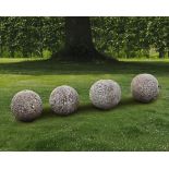 A GROUP OF FOUR STONE ORNAMENTAL SPHERES, LATE 18TH CENTURY