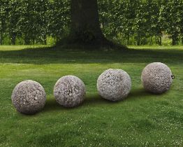 A GROUP OF FOUR STONE ORNAMENTAL SPHERES, LATE 18TH CENTURY