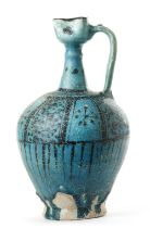 A LARGE RAQQA UNDERGLAZE PAINTED POTTERY EWER, SYRIA, 12TH-13TH CENTURY