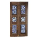 A WOODEN DOOR SET WITH 10 DAMASCUS STYLE POTTERY TILES, 20TH CENTURY