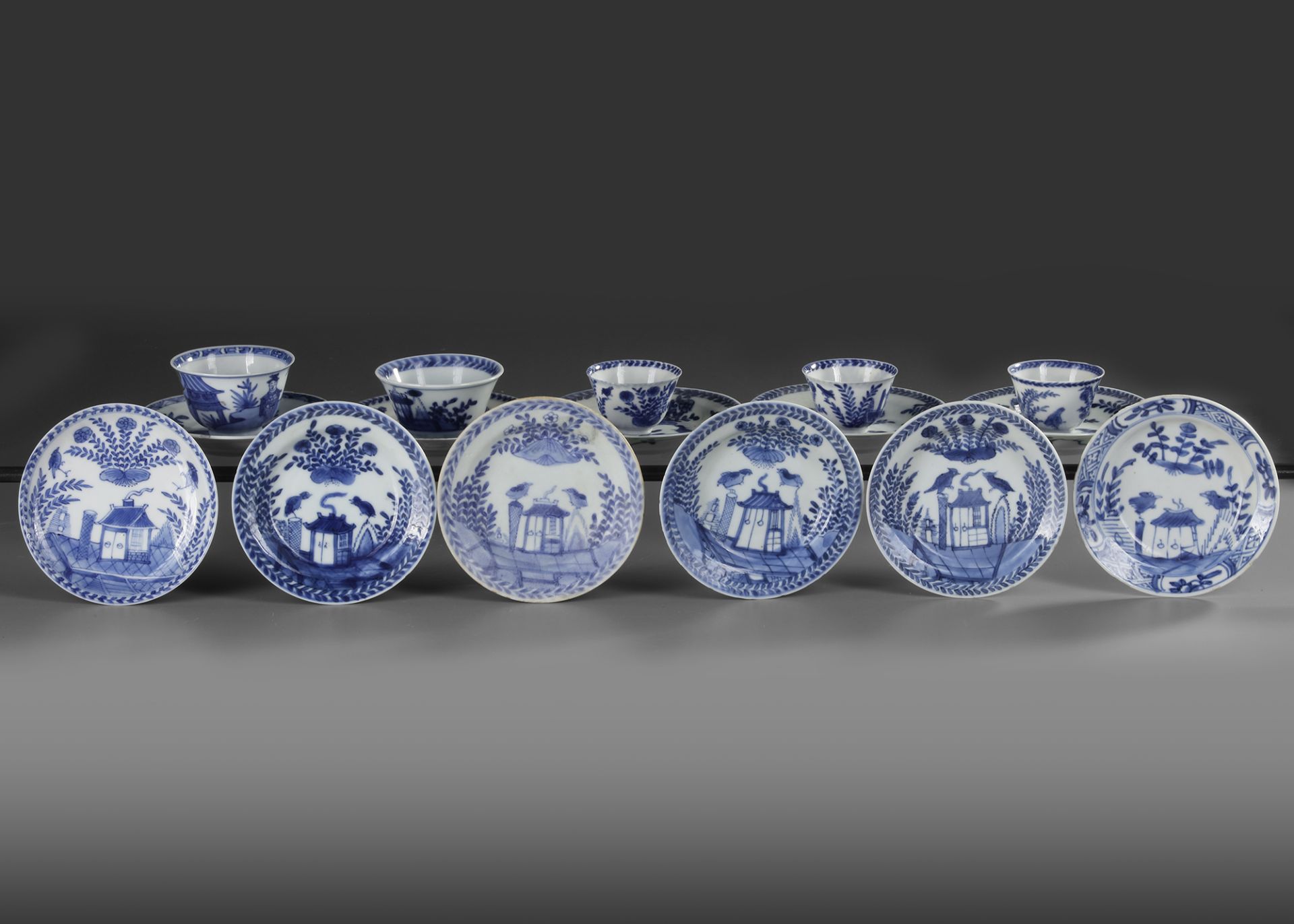 A COLLECTION OF CHINESE BLUE AND WHITE FIVE CUPS AND ELEVEN SAUCERS, 18TH CENTURY