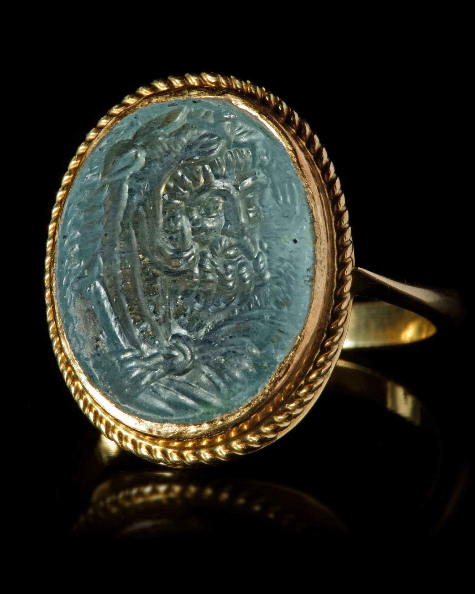 A BEAUTIFUL INTAGLIO IN AQUAMARINE OF A BUST OF HERCULES, 1ST CENTURY AD