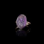 AN ANTIQUE RING WITH A ROMAN AMETHYST INTAGLIO, 1ST CENTURY AD, 18TH CENTURY RING