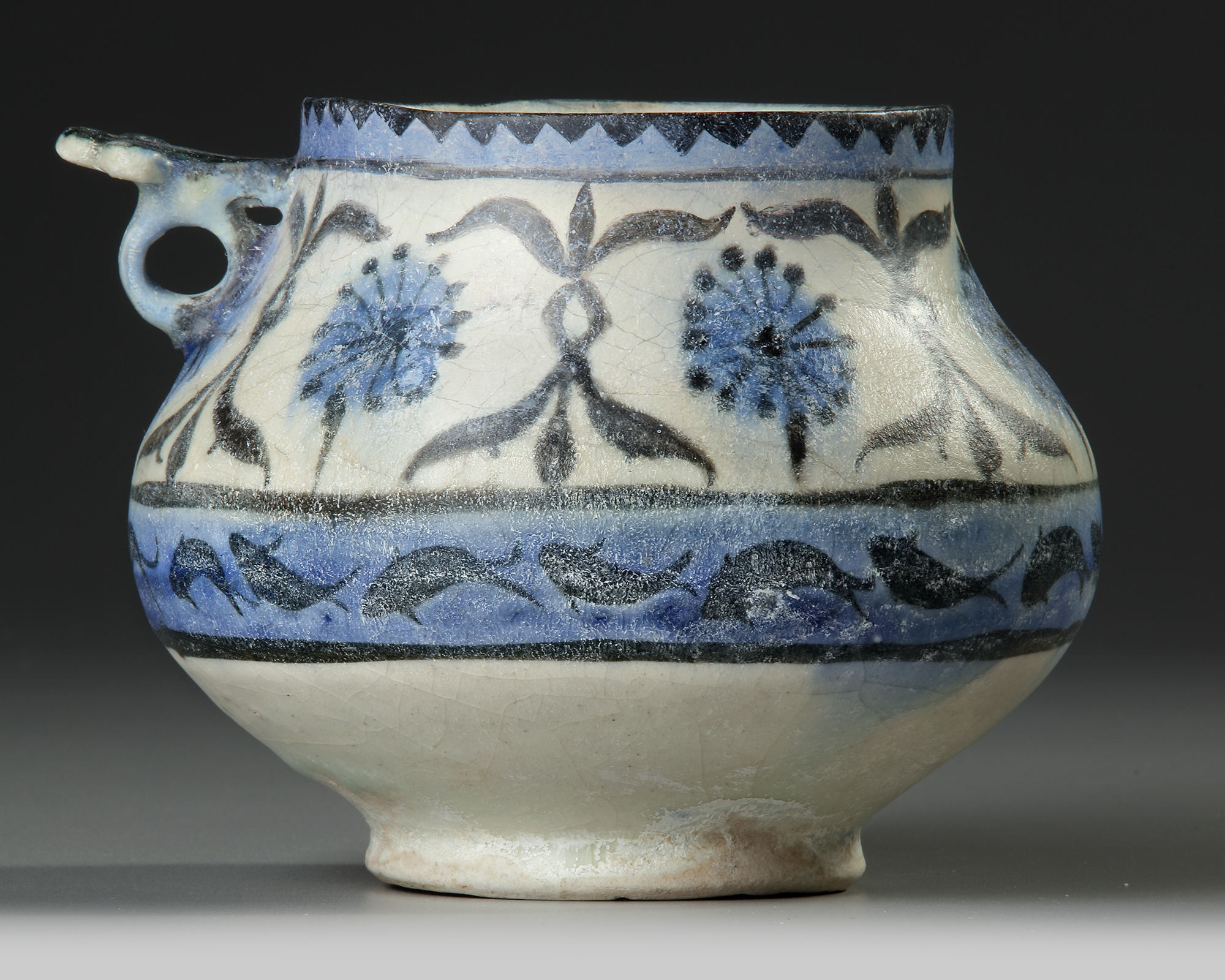 A KASHAN POTTERY JUG, PERSIA, EARLY 13TH CENTURY