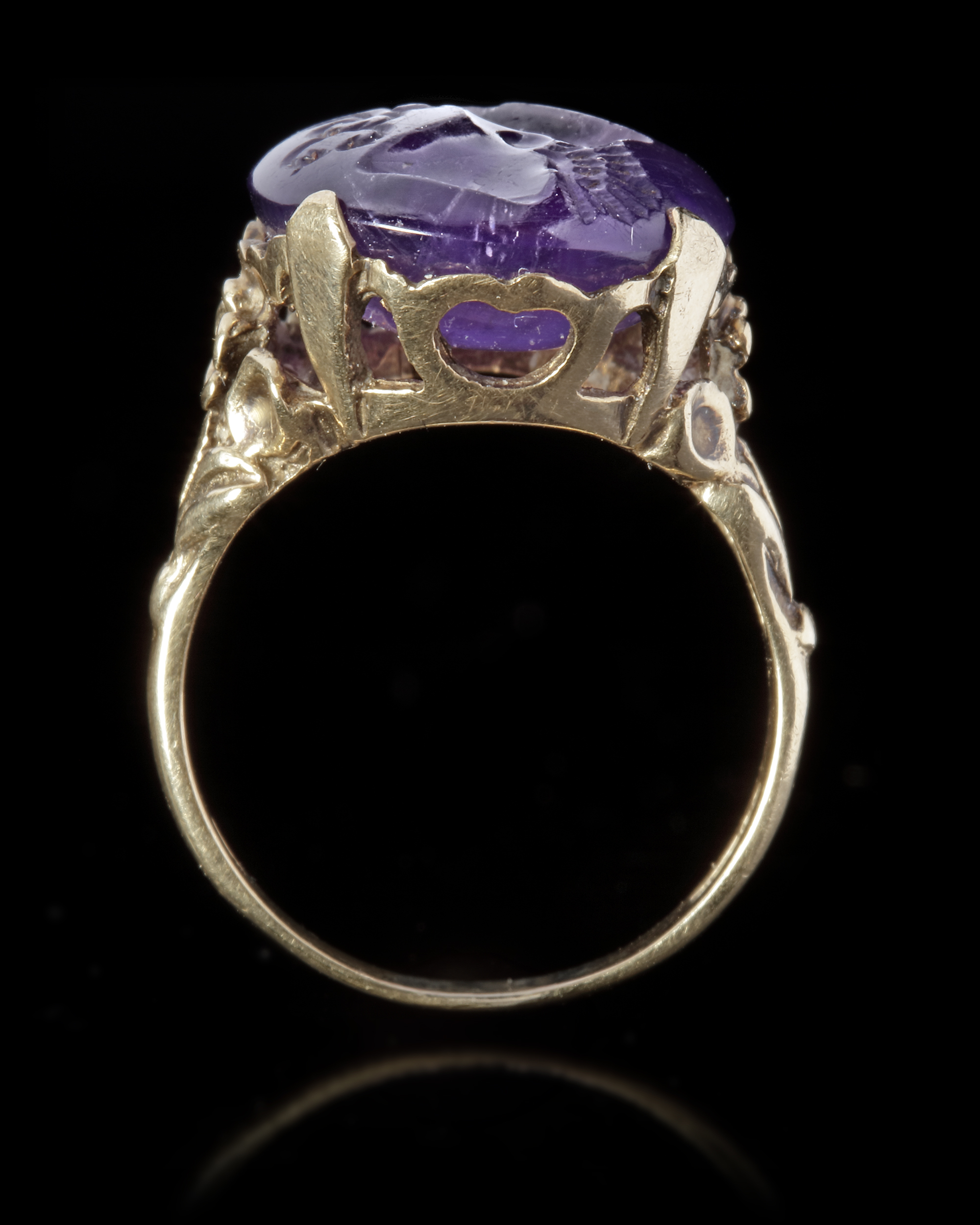 A ROMAN INTAGLIO IN AMETHYST WITH A FOOT OF MERCURY AND BUTTERFLY MOUNTED IN A 19TH CENTURY RING, IN - Image 3 of 4