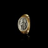 A LARGE ROMAN GOLD RING WITH A BLACK JASPER INTAGLIO OF MINERVA/ATHENA, 1ST CENTURY AD