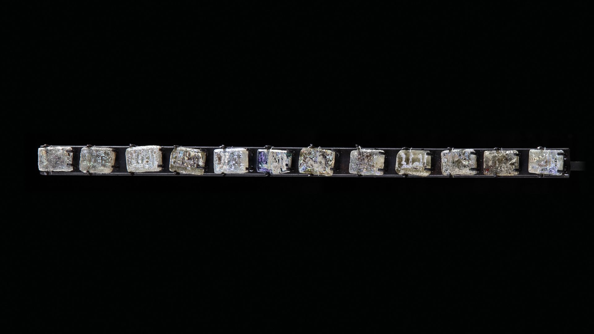 TWELVE GLASS MOULDED FRAGMENTS, PERSIA OR CENTRAL ASIA, 10TH-12TH CENTURY - Image 2 of 6