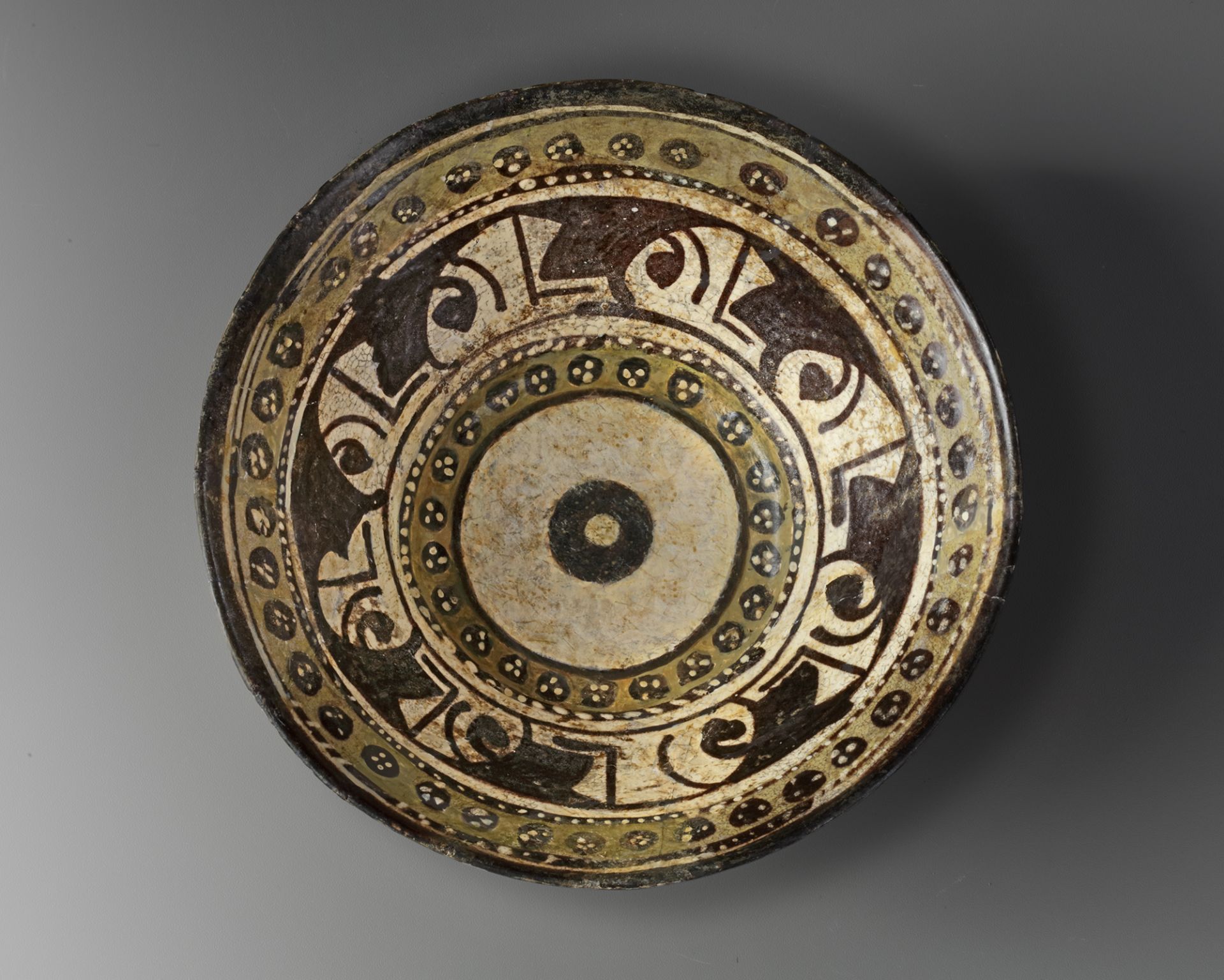 A NISHAPUR CONICAL POTTERY BOWL, PERSIA, LATE 9TH-EARLY 10TH CENTURY
