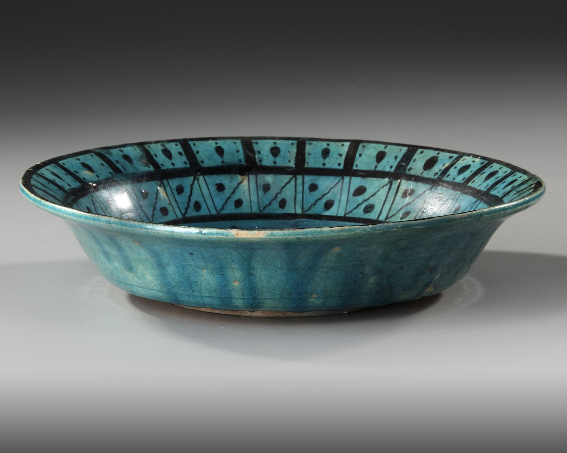 A RAQQA TURQUOISE-GLAZED POTTERY DISH, SYRIA, EARLY 13TH CENTURY - Image 3 of 8