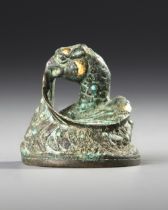 A CHINESE GOLD AND SILVER-INLAID BRONZE FIGURE OF A MYTHICAL BEAST WEIGHT, HAN DYNASTY (206 BC-AD 22