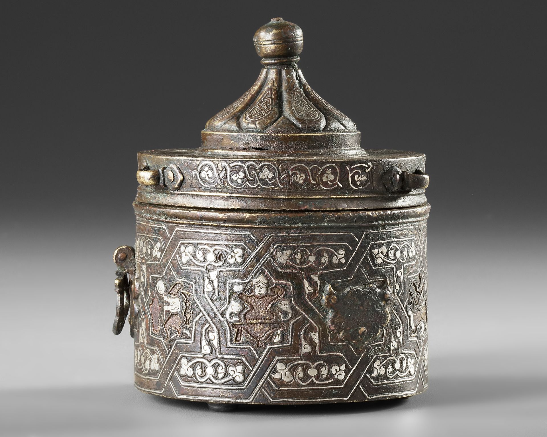 A FINE BRONZE INKWELL WITH A DOMED LID, KHORASAN, PERSIA, EARLY 13TH CENTURY