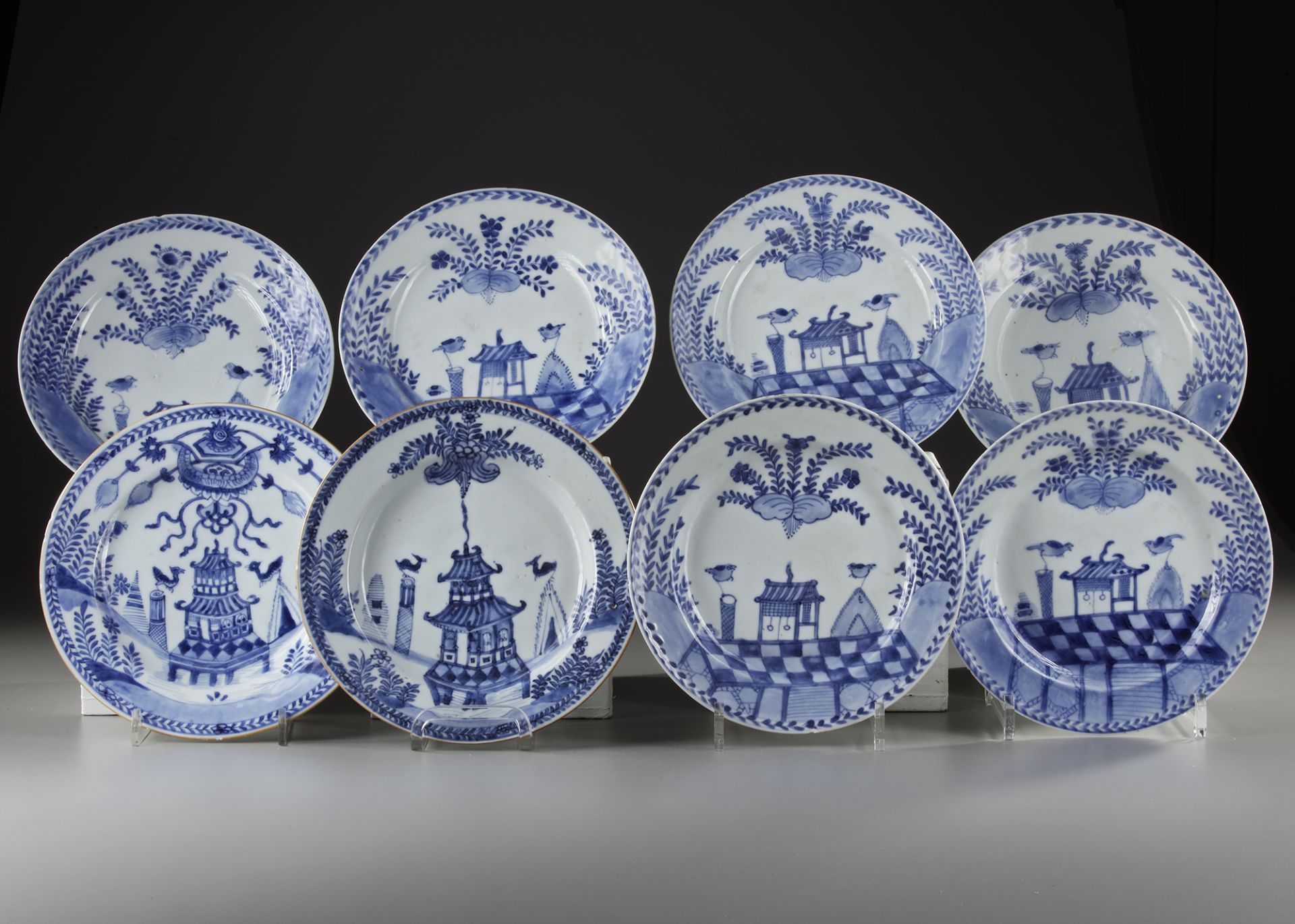 EIGHT CHINESE BLUE AND WHITE 'CUCKOO IN THE HOUSE' DISHES, 18TH CENTURY