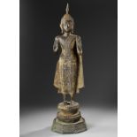 A GILT BRONZE STANDING FIGURE OF A BUDDHA, LATE 19TH CENTURY