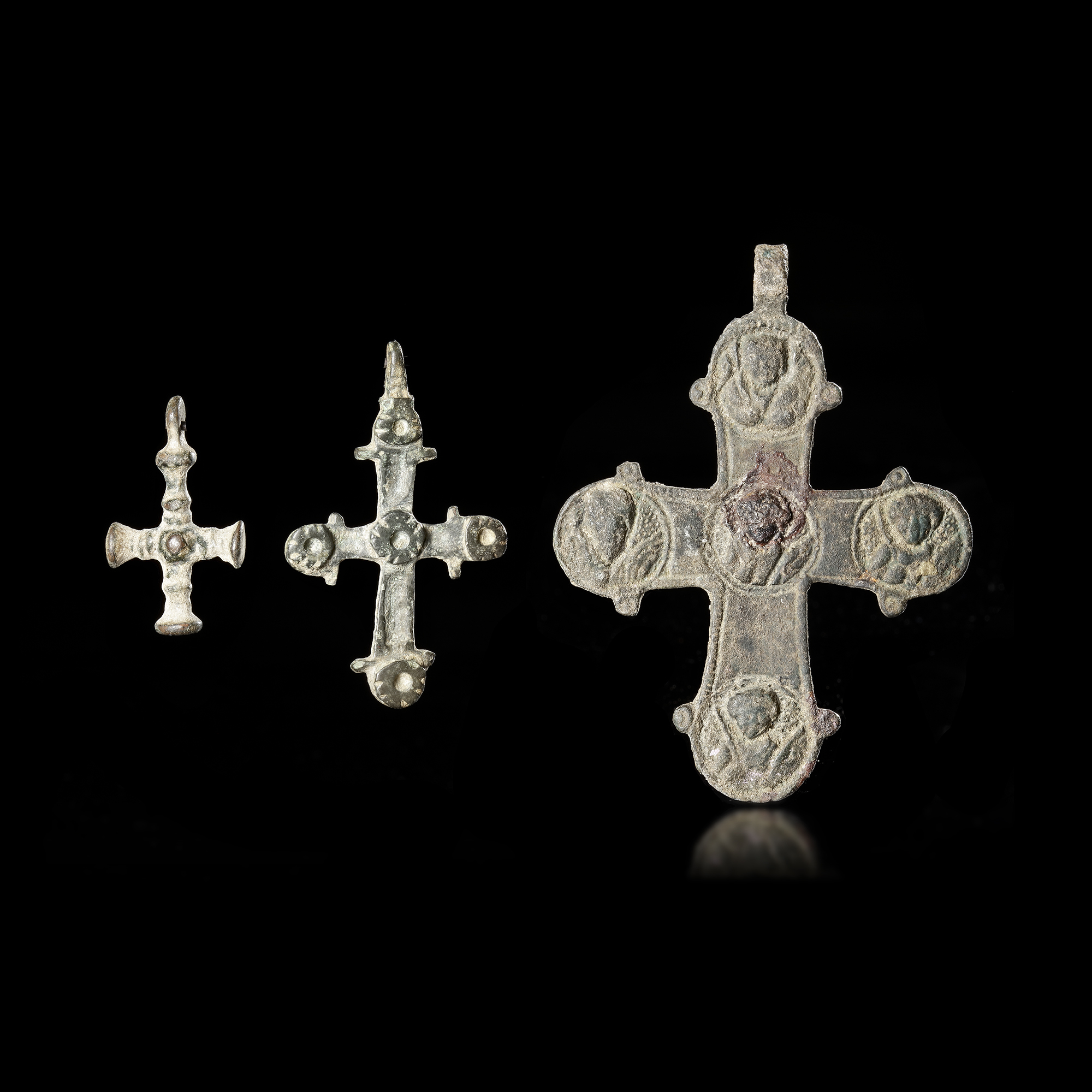 THREE BYZANTINE BRONZE PECTORAL CROSSES, 6TH-8TH CENTURY AD