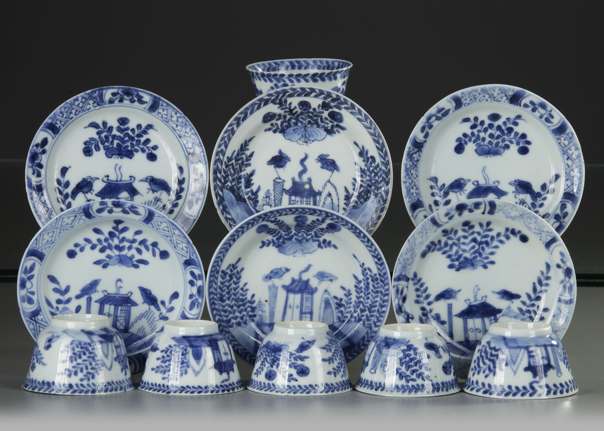 SIX CHINESE BLUE AND WHITE 'CUCKOO IN THE HOUSE' CUPS AND SAUCERS, 18TH CENTURY