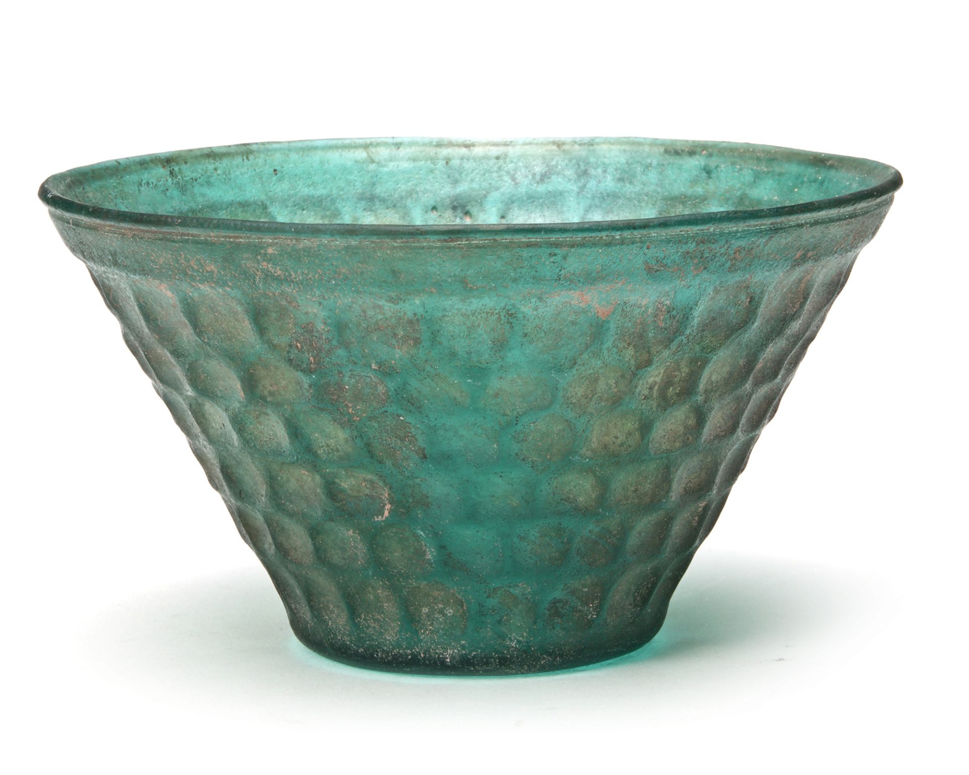 A PERSIAN GREEN CUT GLASS BOWL, 8TH-9TH CENTURY