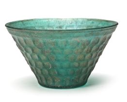 A PERSIAN GREEN CUT GLASS BOWL, 8TH-9TH CENTURY