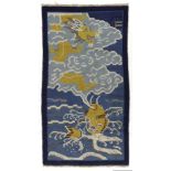 A CHINESE DRAGON AND FISH RUG, 20TH CENTURY