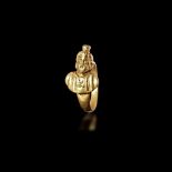 A ROMAN GOLD RING WITH A BUST OF SERAPIS, 1ST CENTURY AD