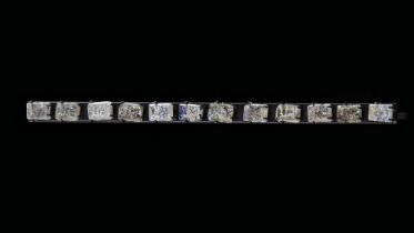 TWELVE GLASS MOULDED FRAGMENTS, PERSIA OR CENTRAL ASIA, 10TH-12TH CENTURY