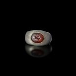 A ROMAN SILVER RING WITH A SMALL CARNELIAN INTAGLIO OF A RABBIT, 2ND-3RD CENTURY AD