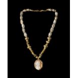 A NECKLACE WITH A CAMEO PENDANT AND NECKLACE OF ANCIENT BEADS OF VARIOUS PERIODS, 3RD CENTURY BC TO