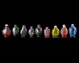 A COLLECTION OF 9 SNUFF BOTTLES IN VARIOUS MATERIALS, QING DYNASTY (1644-1911)