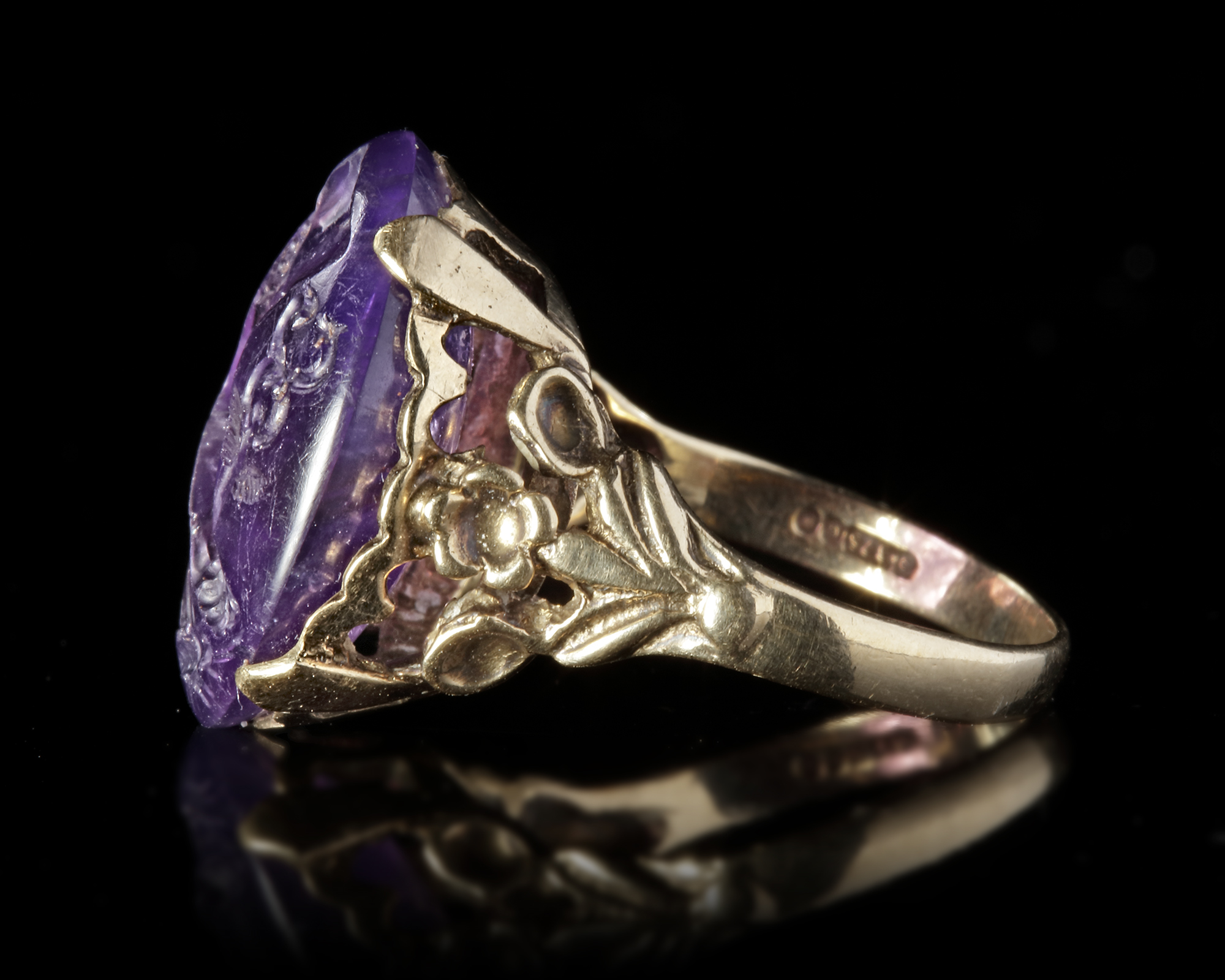 A ROMAN INTAGLIO IN AMETHYST WITH A FOOT OF MERCURY AND BUTTERFLY MOUNTED IN A 19TH CENTURY RING, IN - Image 2 of 4