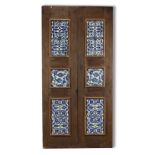 A WOODEN DOOR SET WITH 10 DAMASCUS STYLE POTTERY TILES, 20TH CENTURY