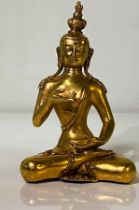 Gold colored Indian statue of Buddah