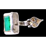Silver cufflink with green stone