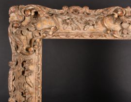 19th Century French School. A Carved Giltwood Frame, with swept centres and corners, rebate 30" x