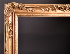 20th Century English School. A Gilt Composition Frame, with swept and pierced centres and corners,