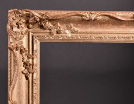 20th Century English School. A Gilt Composition Frame, with swept and pierced centres and corners,