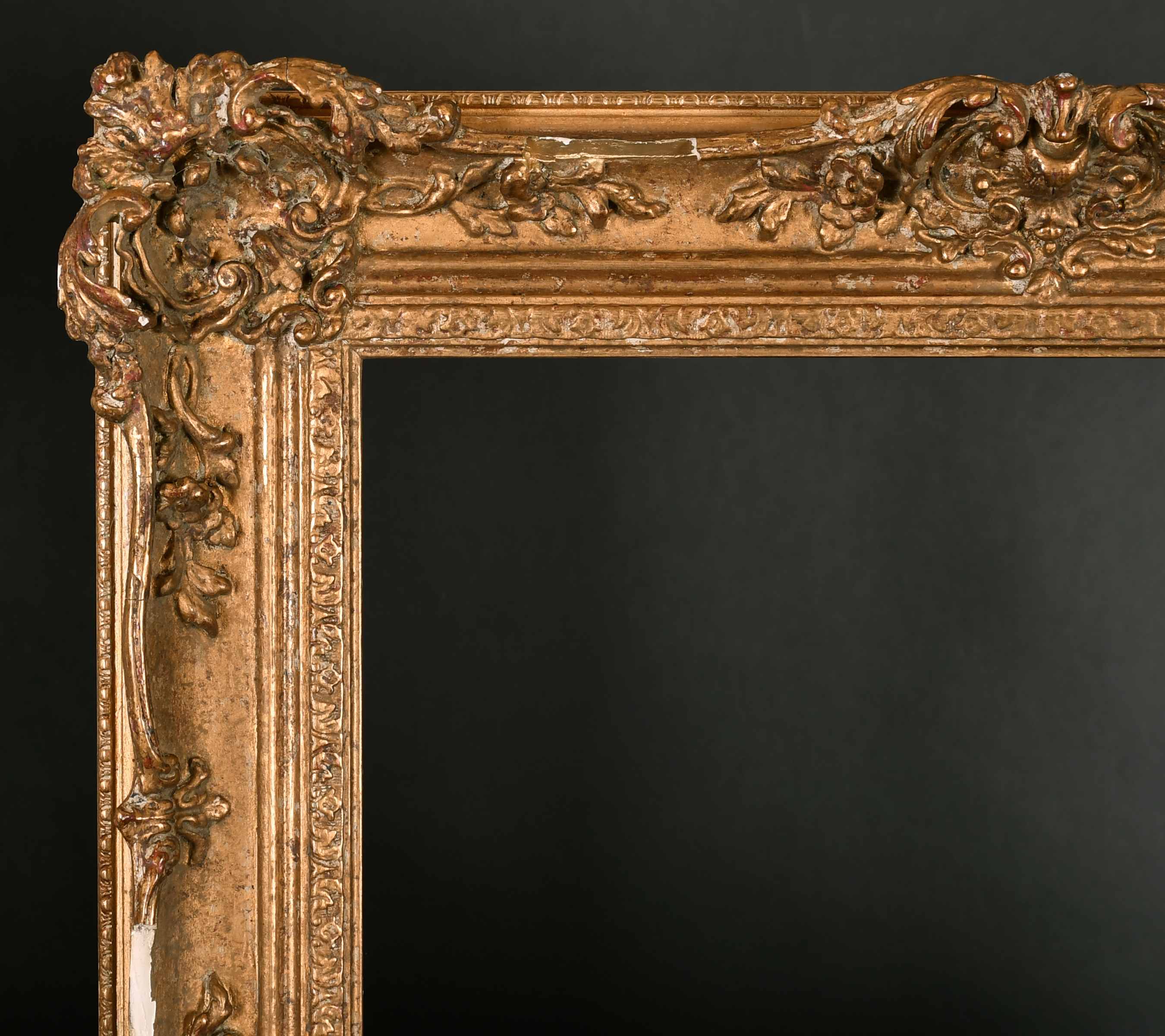 20th Century English School. A Gilt Composition Frame, with swept and pierced centres and corners,