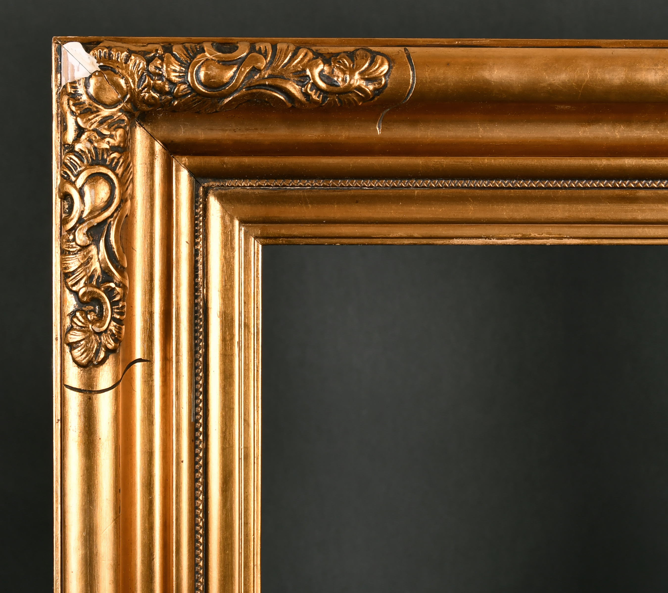 Early 20th Century European School. A Gilt Composition Frame, with swept corners, rebate 30" x 20.