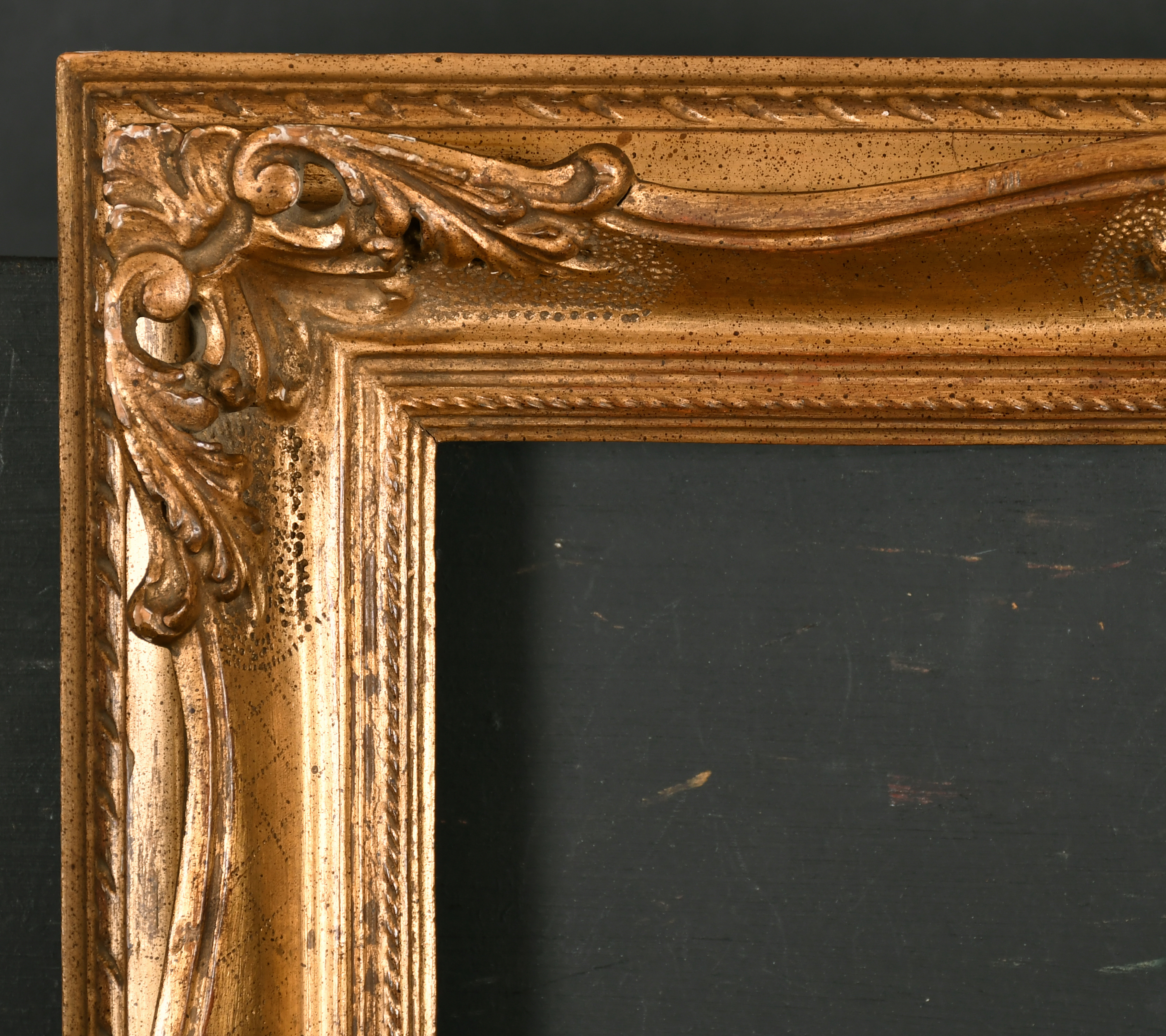 20th Century European School. A Carved Giltwood Frame, with swept and pierced centres and corners,