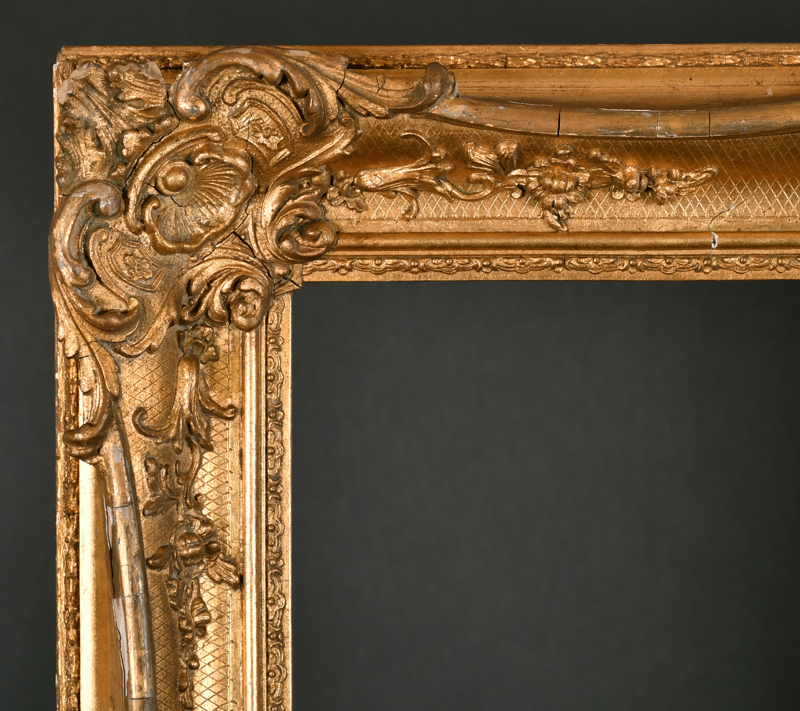 19th Century English School. A Gilt Composition Frame with swept centres and corners, rebate 32.