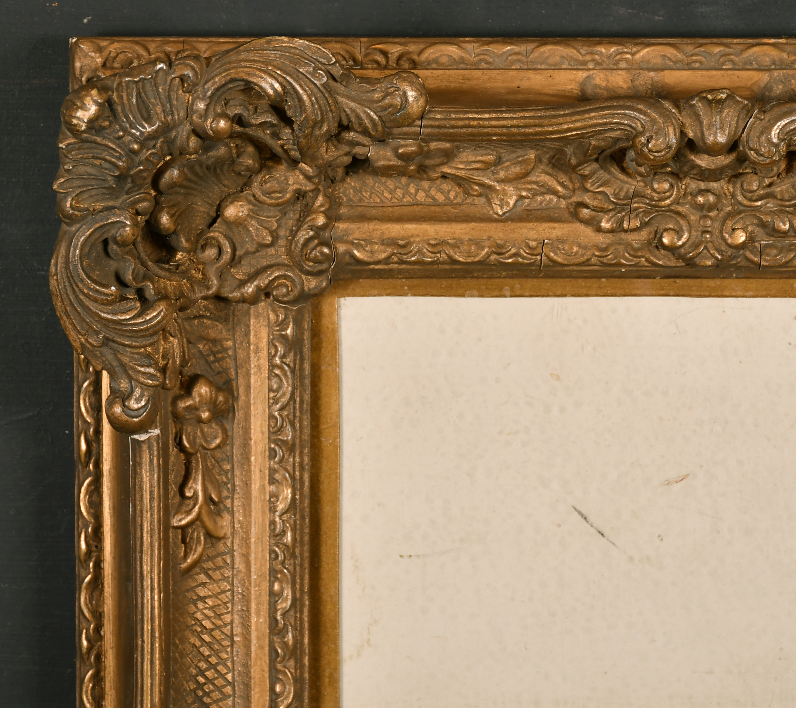 Early 20th Century French School. A Gilt Composition Frame, with swept and pierced centres and