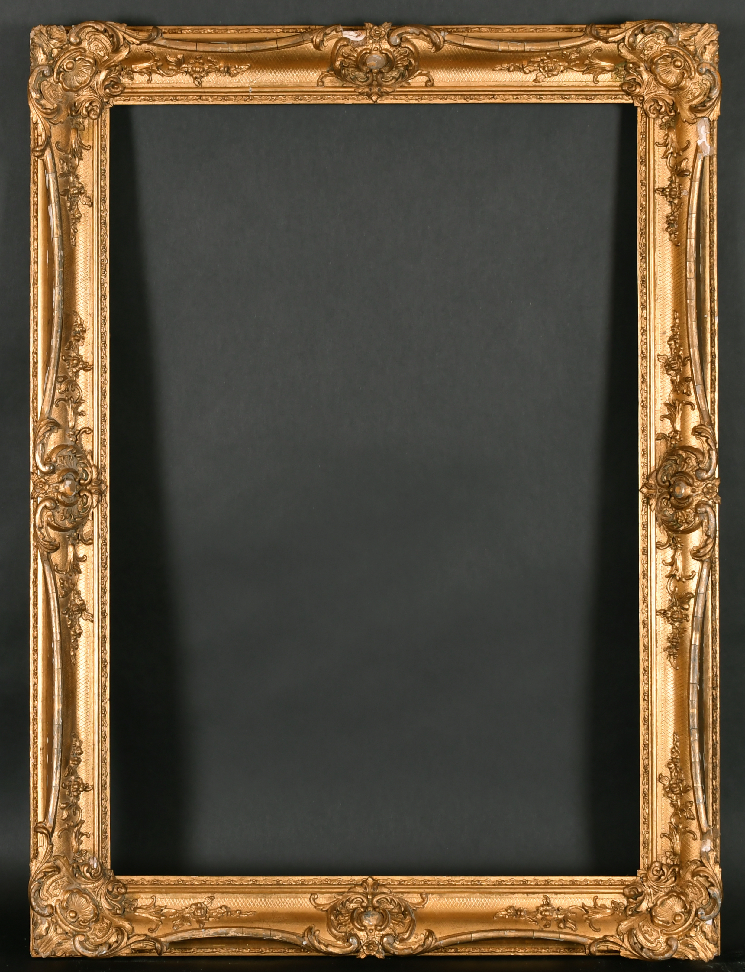 19th Century English School. A Gilt Composition Frame with swept centres and corners, rebate 32. - Image 2 of 3