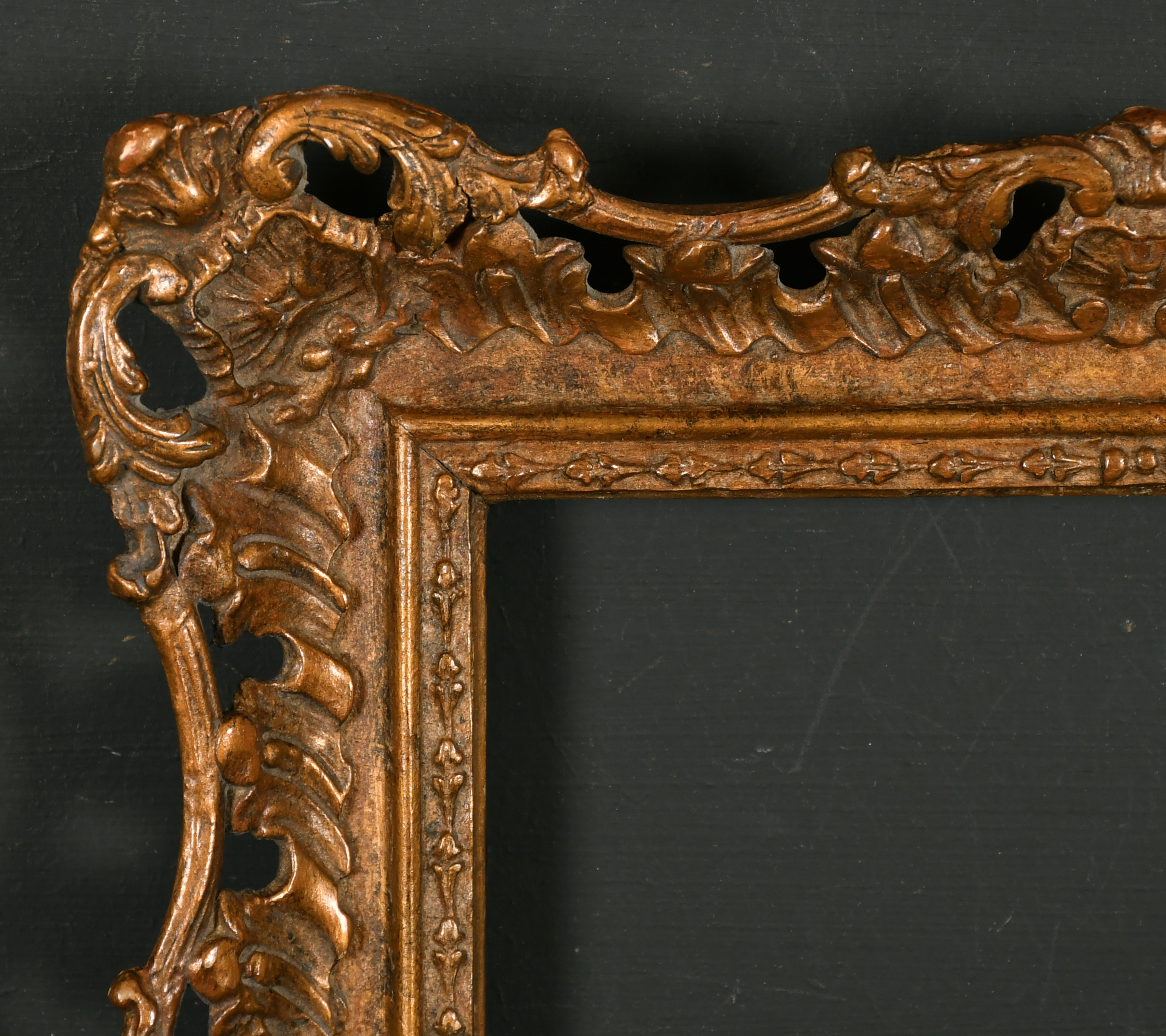 20th Century English School. A Gilt Composition Frame, with swept and pierced centres and corners,